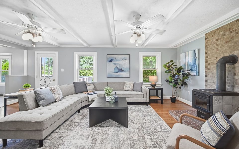 A professionally staged living room with a sectional sofa